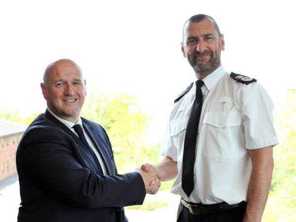 PCC Dafydd Llywelyn shaking hands with Chief Constable Dr. Richard Lewis before their first official meeting of the new Police and Crime Commissioner's Term in Office